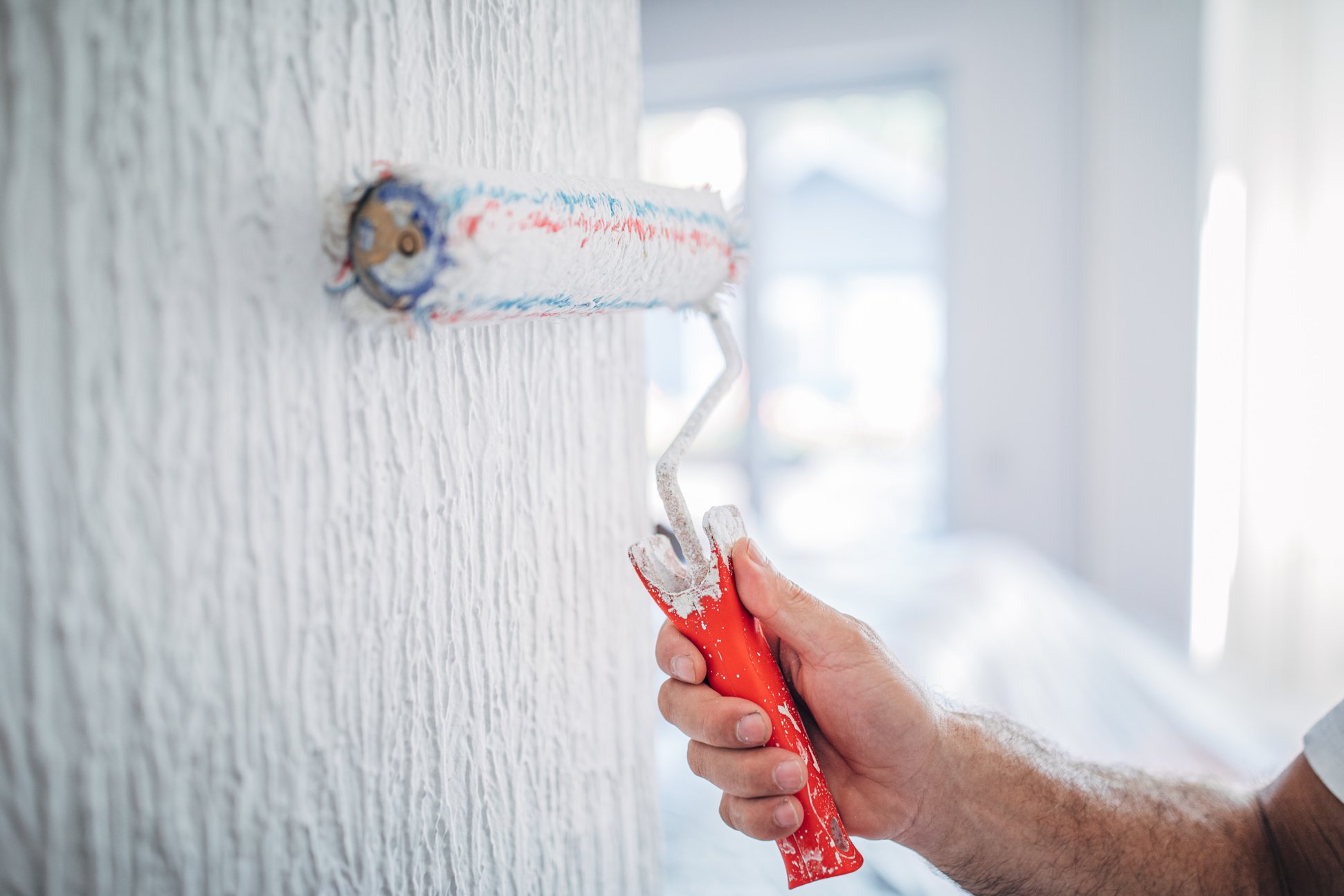 House painter painting a wall