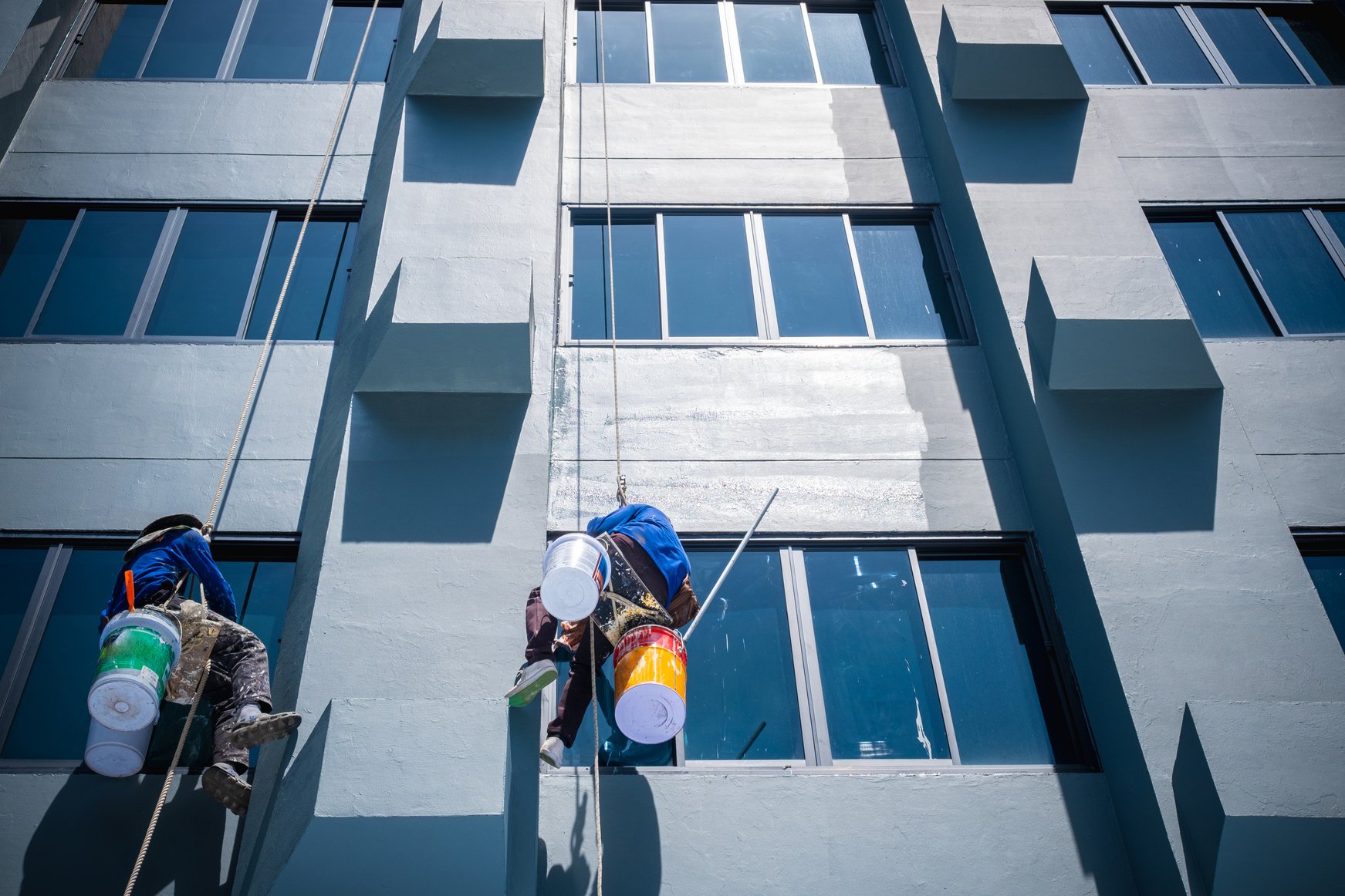 Painters Are Hanging on Ropes